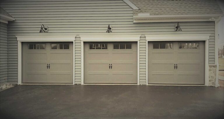 Sectional wholesale garage doors installed at a commercial building by Upright Door.