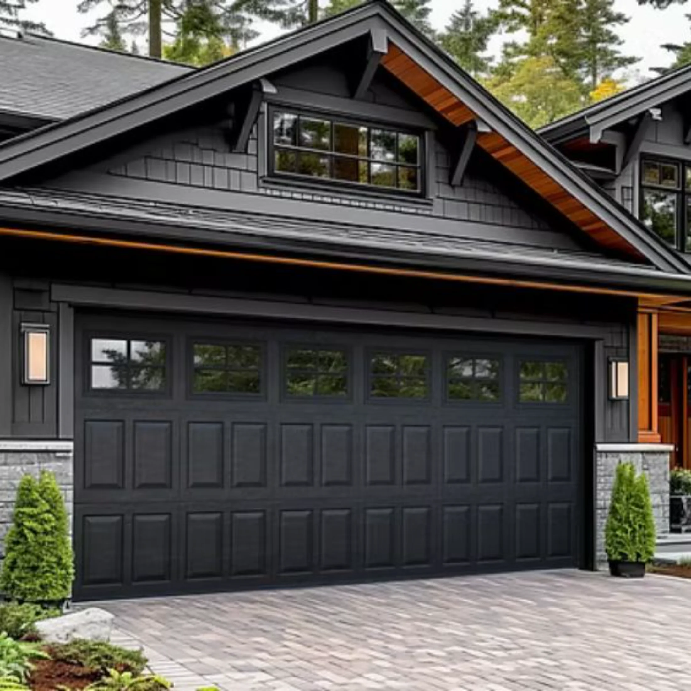 newly installed black garage door on home