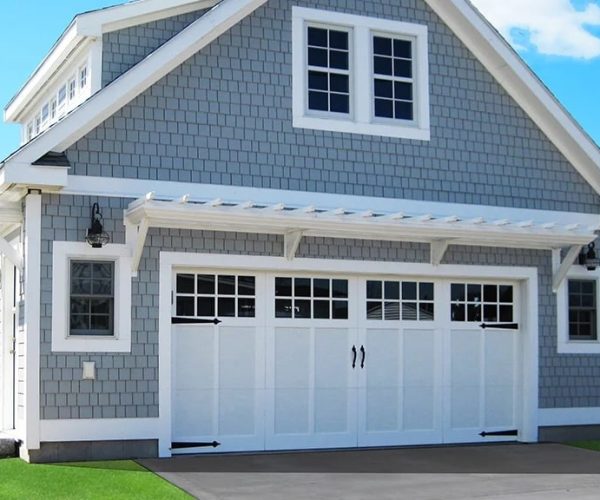 uprightdoor-general-doors-8-panel Classic carriage house wholesale garage doors with decorative hardware.