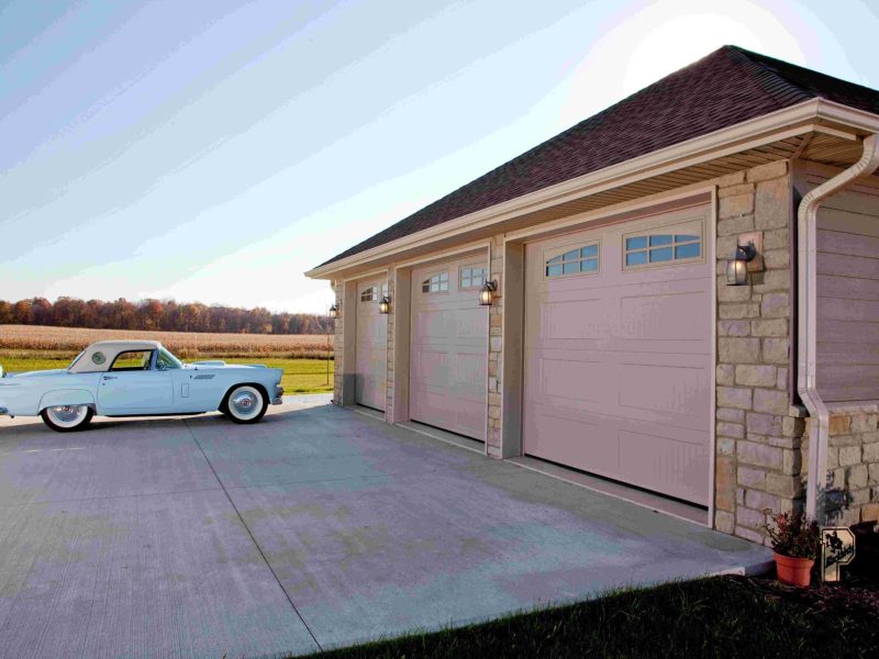 Traditional raised panel wholesale garage doors with window accents